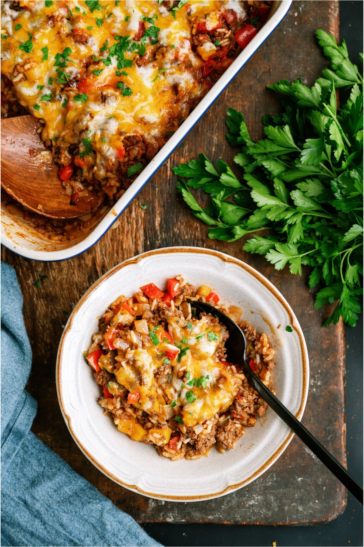 Top view of a bowl of Stuffed Pepper Casserole with the remaining casserole next to it in a casserole dish.