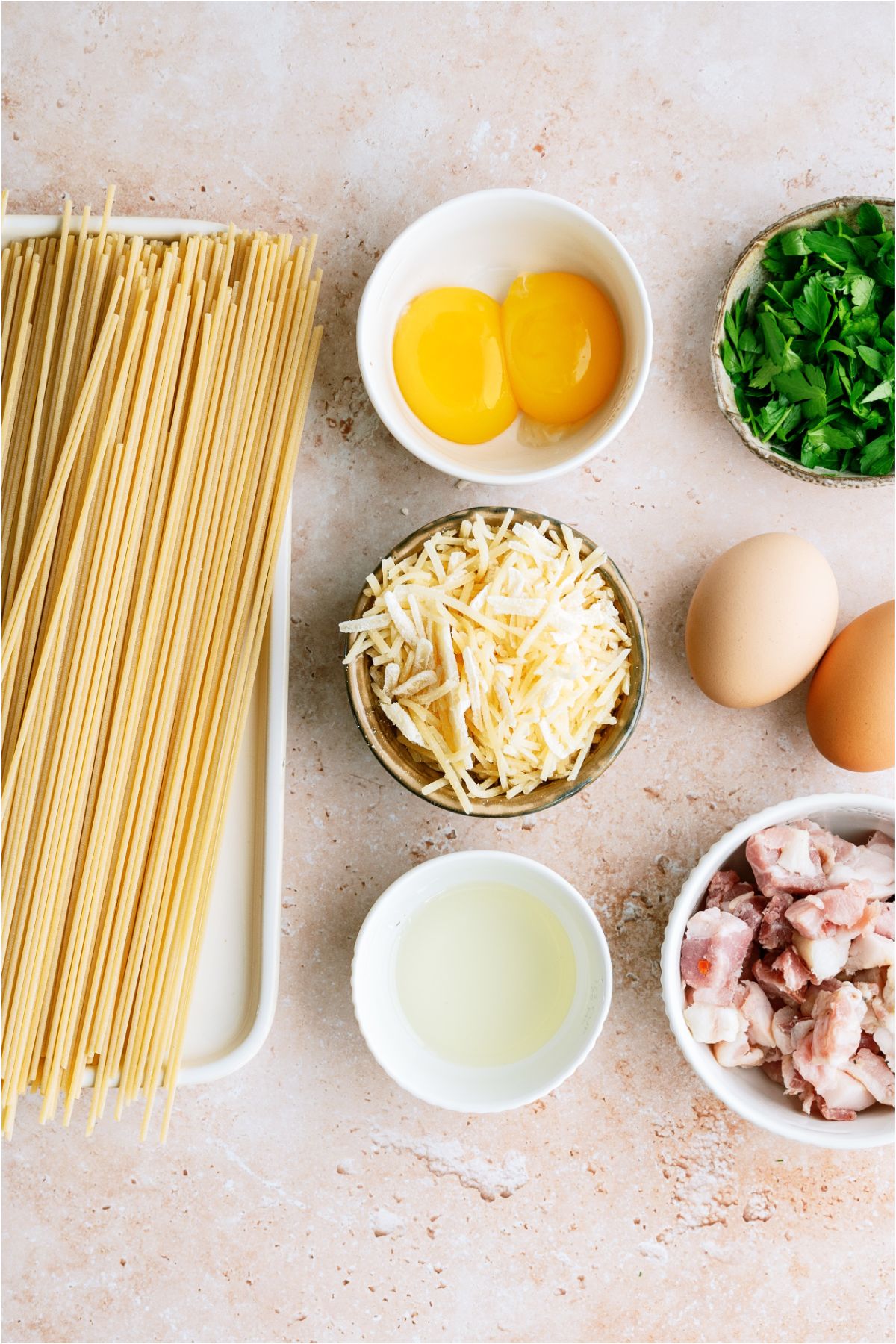 Ingredients needed to make Classic Pasta Carbonara.