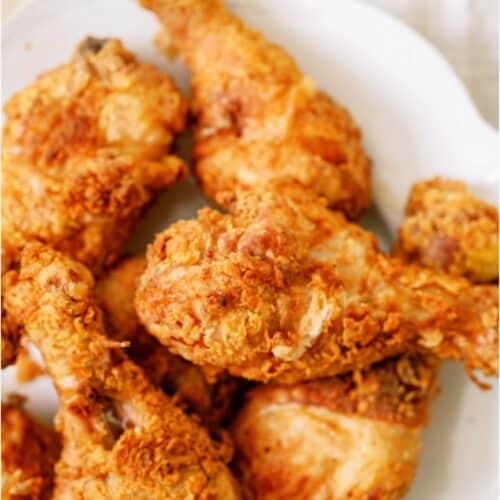 A plate of fried chicken on a table.