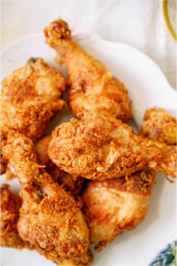 A plate of fried chicken on a table.