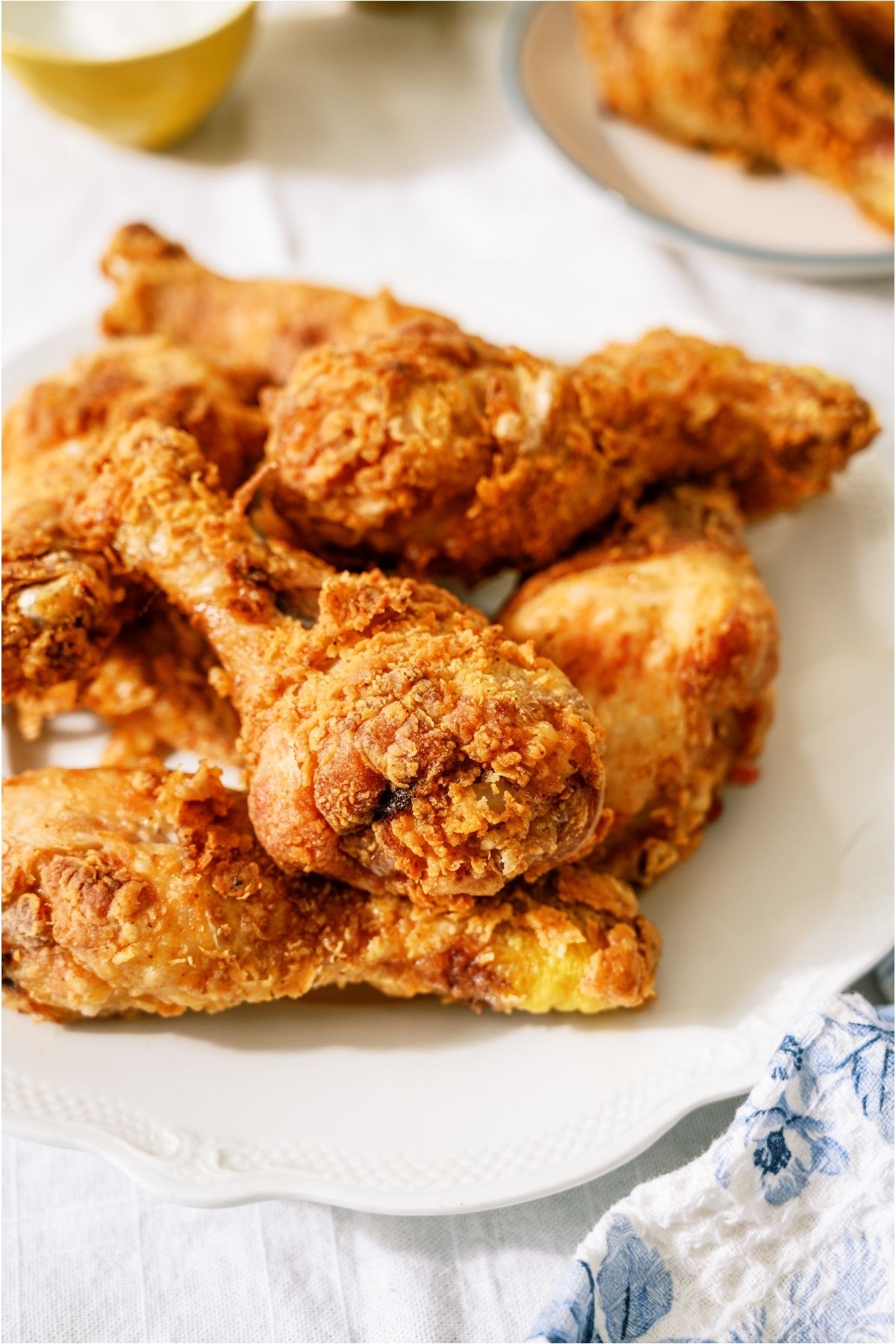 Close up of Crispy Fried Chicken on a white plate.