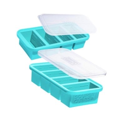 two teal silicone souper cube trays with lids for food storage