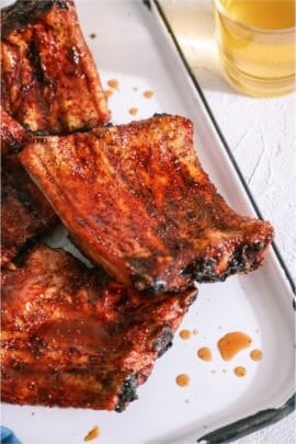 Grilled Baby Back Ribs on a white serving platter.