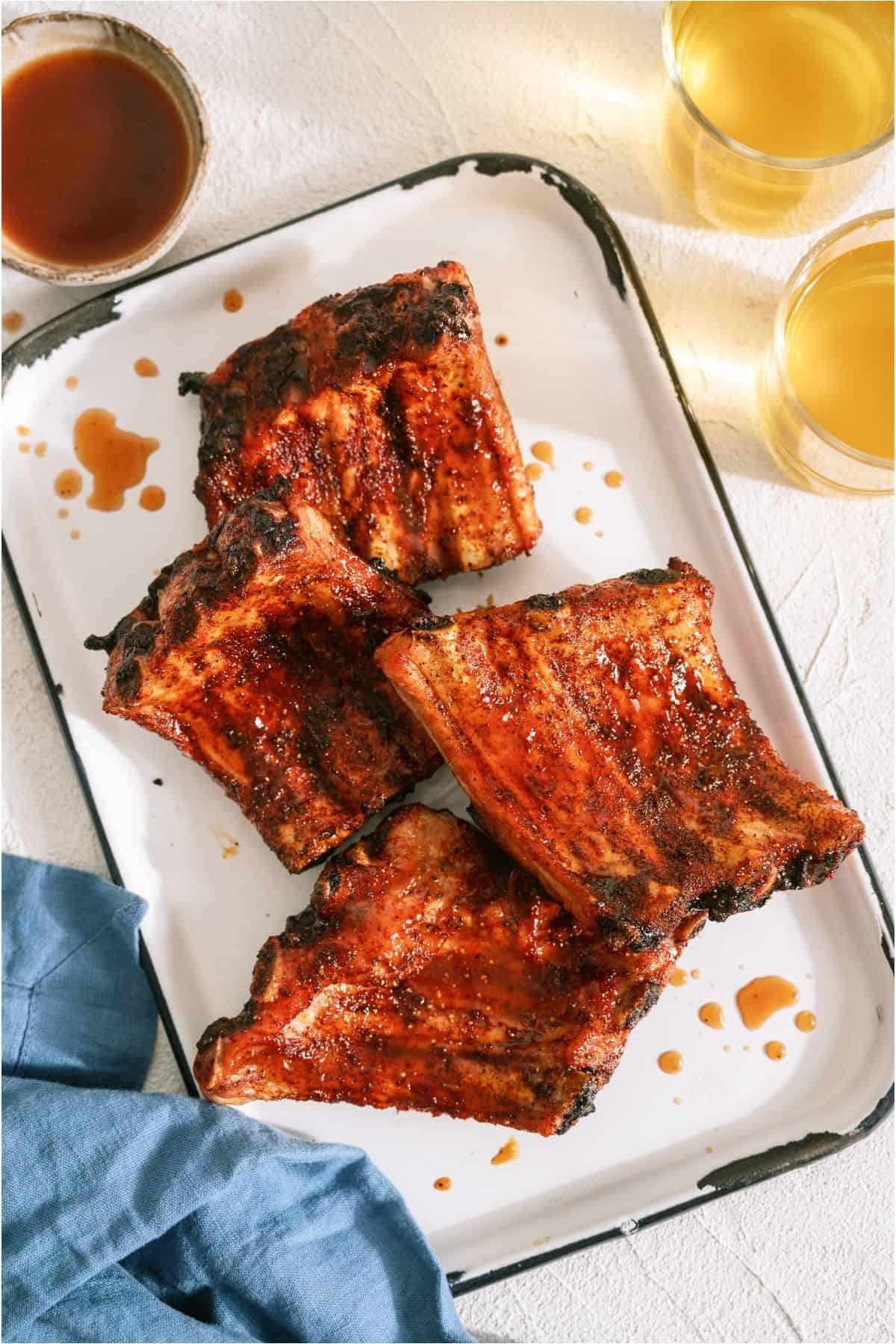 Grilled Baby Back Ribs on a white serving plate.