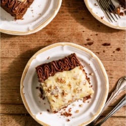 3 slices of Homemade German Chocolate Cake on plates with forks.