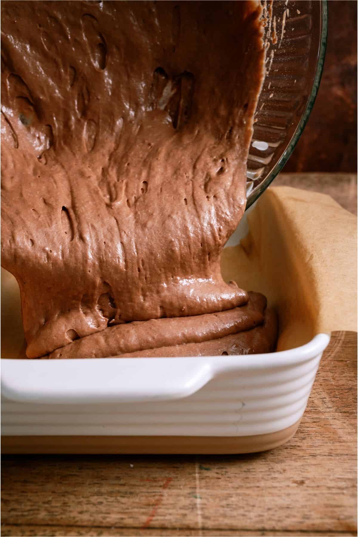 German Chocolate Cake batter being poured into a baking dish.