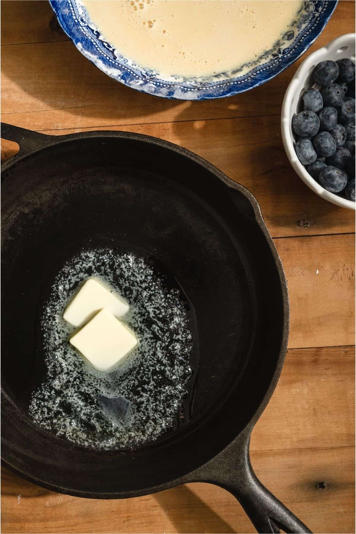 2 pads of butter in a hot cast iron skillet.