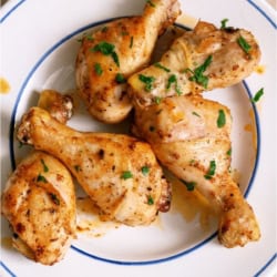 Top view of a plate of Juicy Baked Chicken Legs.