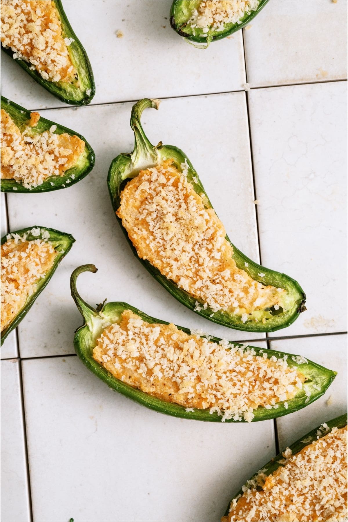 Crispy Jalapeno Poppers on a white tile background.