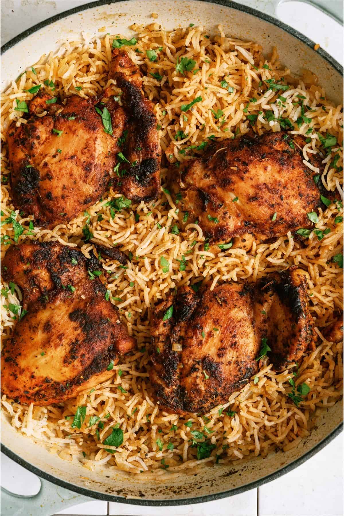 Close up of One Pot Chicken and Rice inside a skillet.