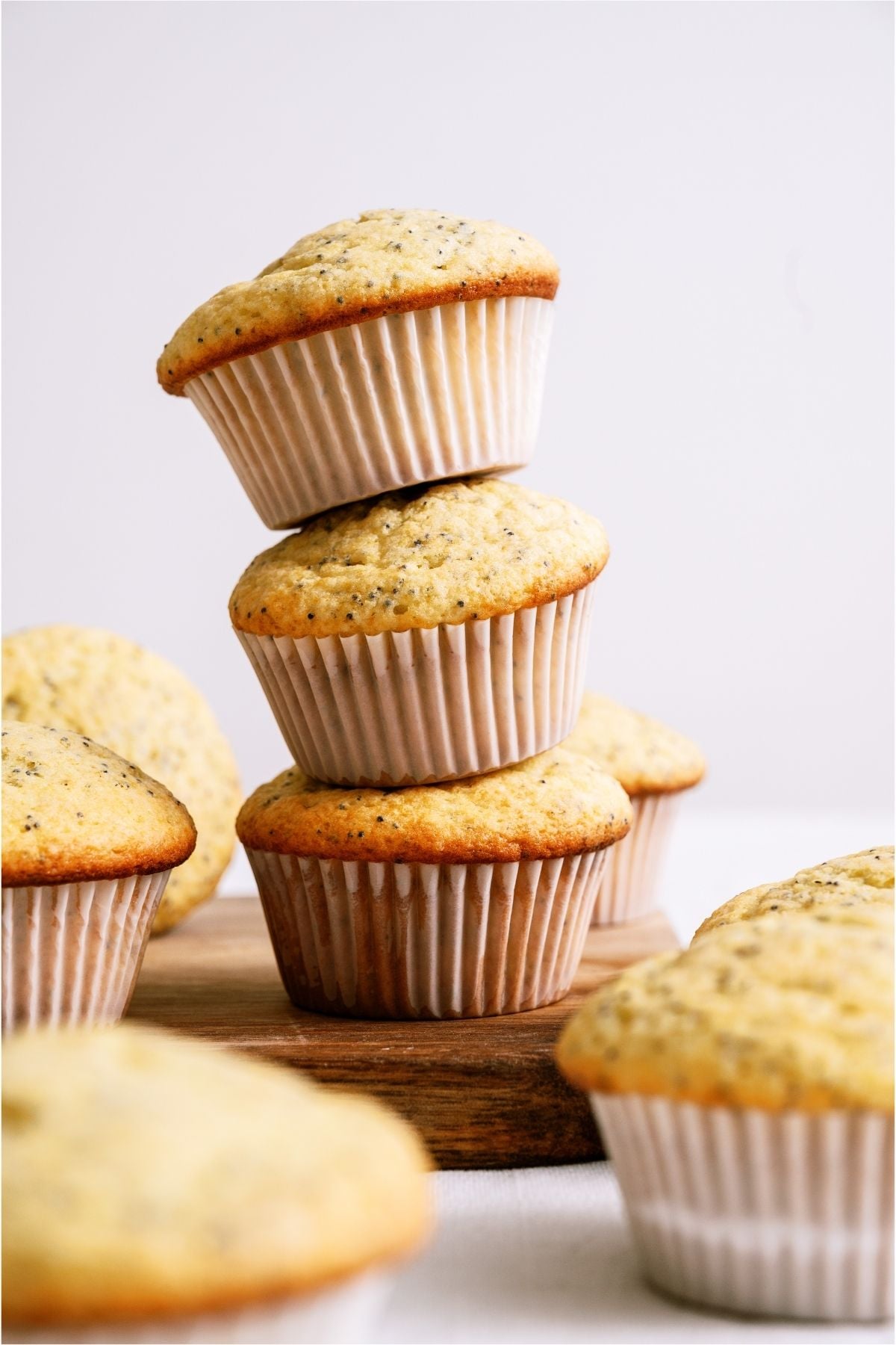 3 Almond Poppy Seed Muffins stacked.