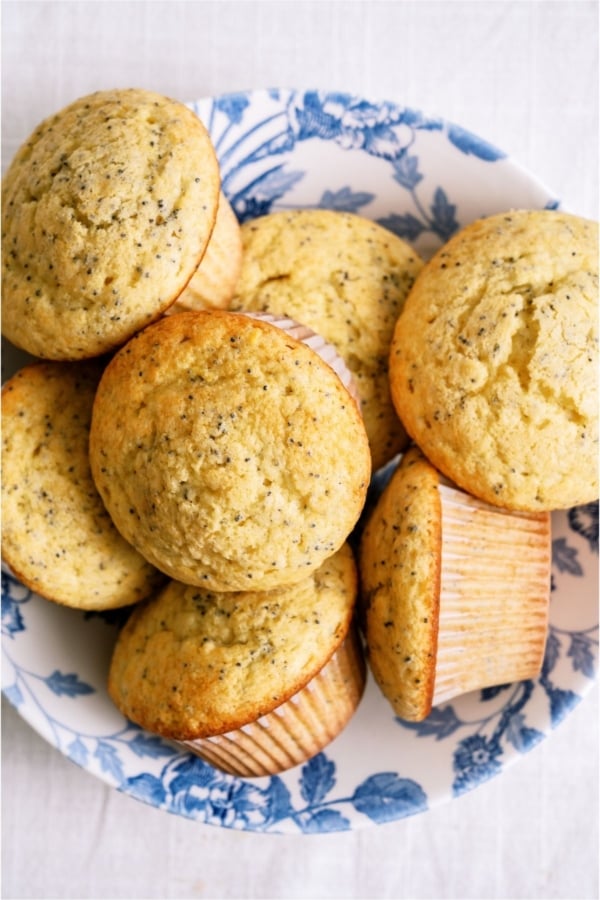 Top view of a plate full of Almond Poppy Seed Muffins.