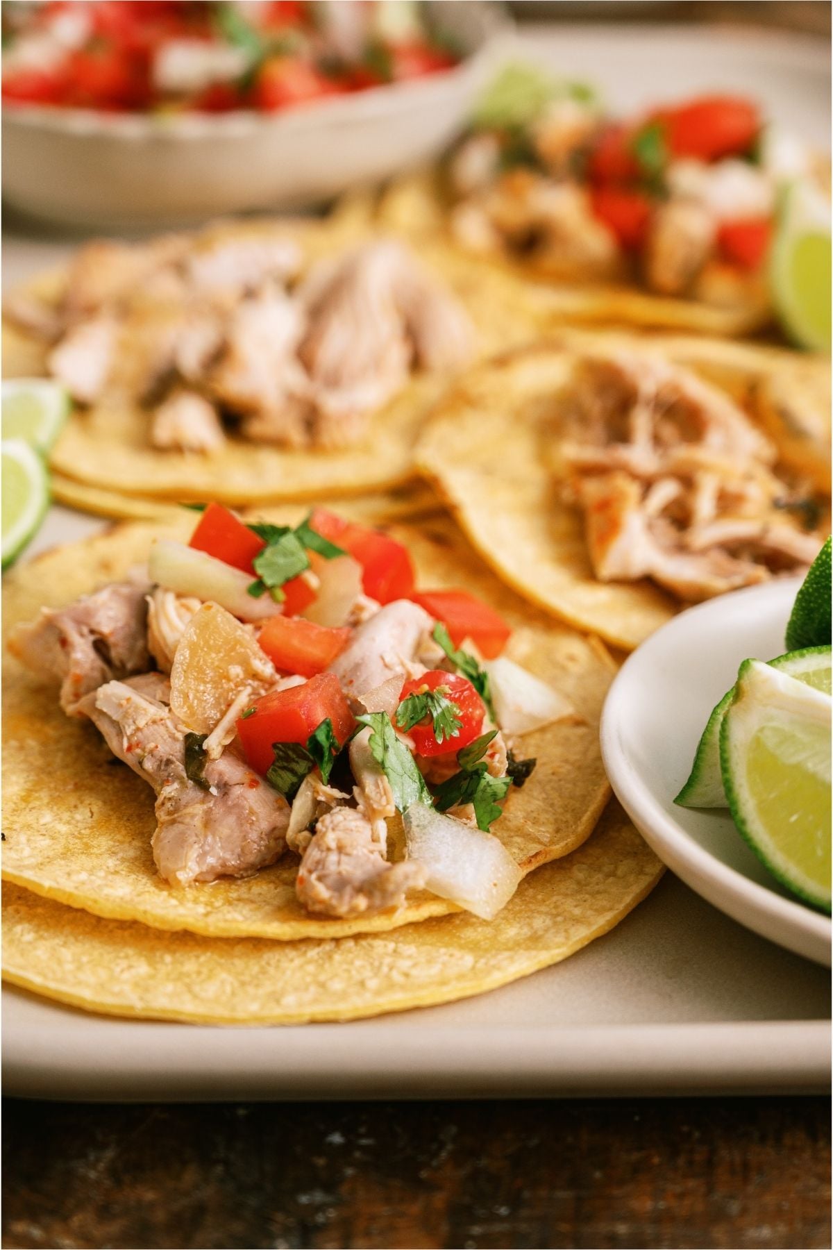 Close up of shredded Slow Cooker Chili Lime Chicken on a tortilla.