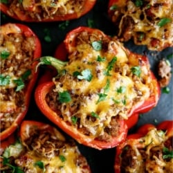 Top view of Air Fryer Stuffed Peppers on a dark background.