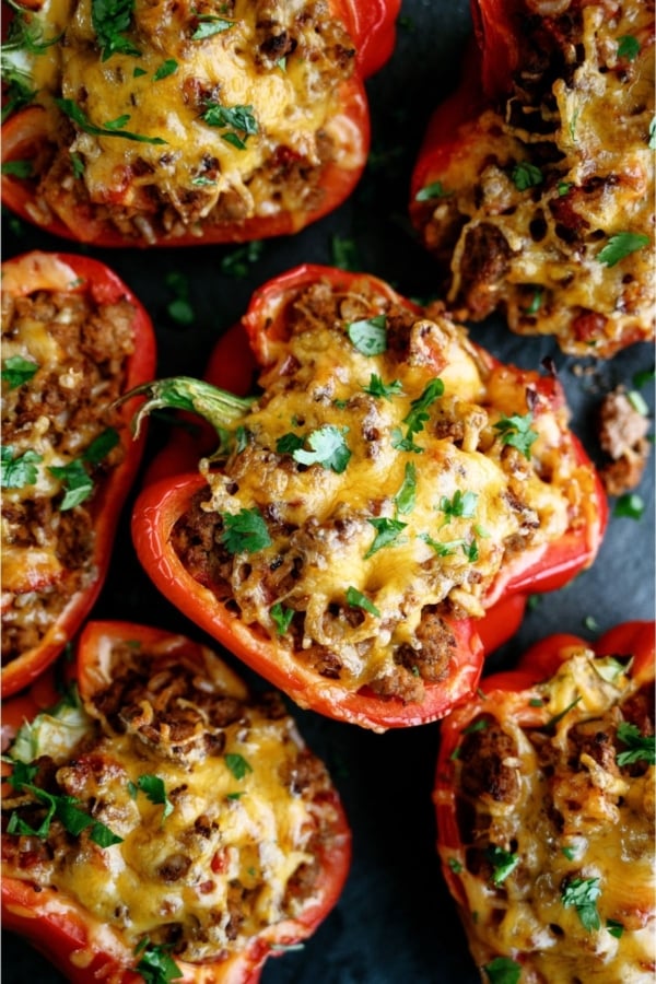 Top view of Air Fryer Stuffed Peppers on a dark background.