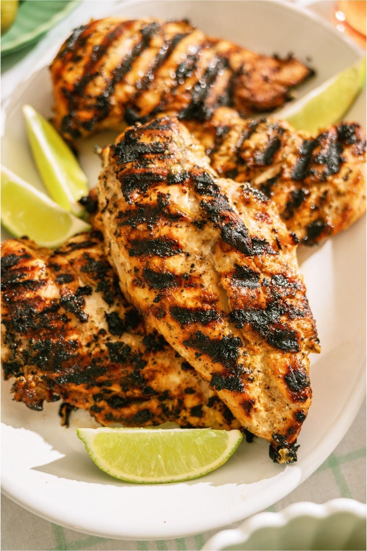 A close up of Grilled Mango Coconut Chicken on a plate.