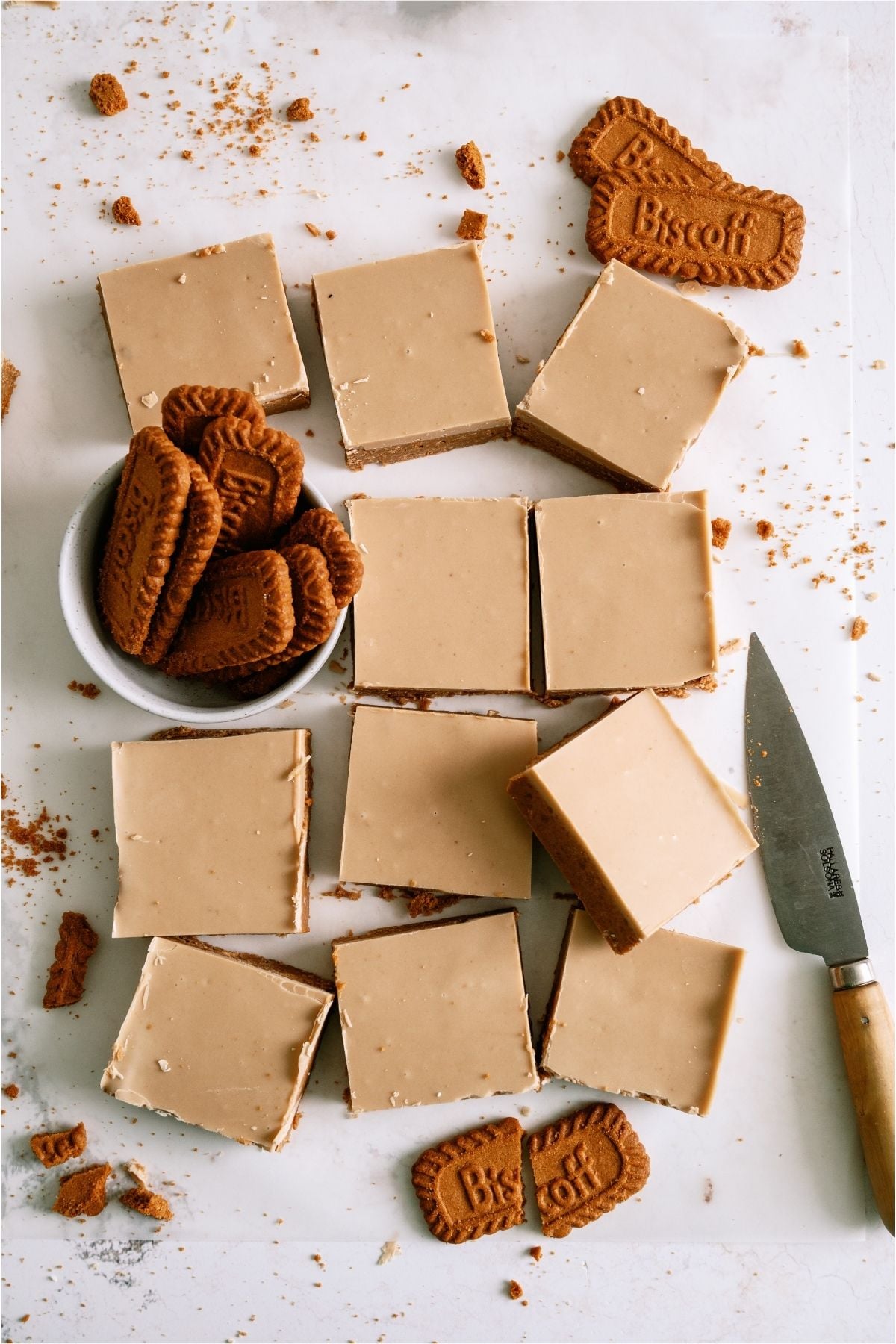 No Bake Biscoff Bars cut into squares with biscoff cookies.