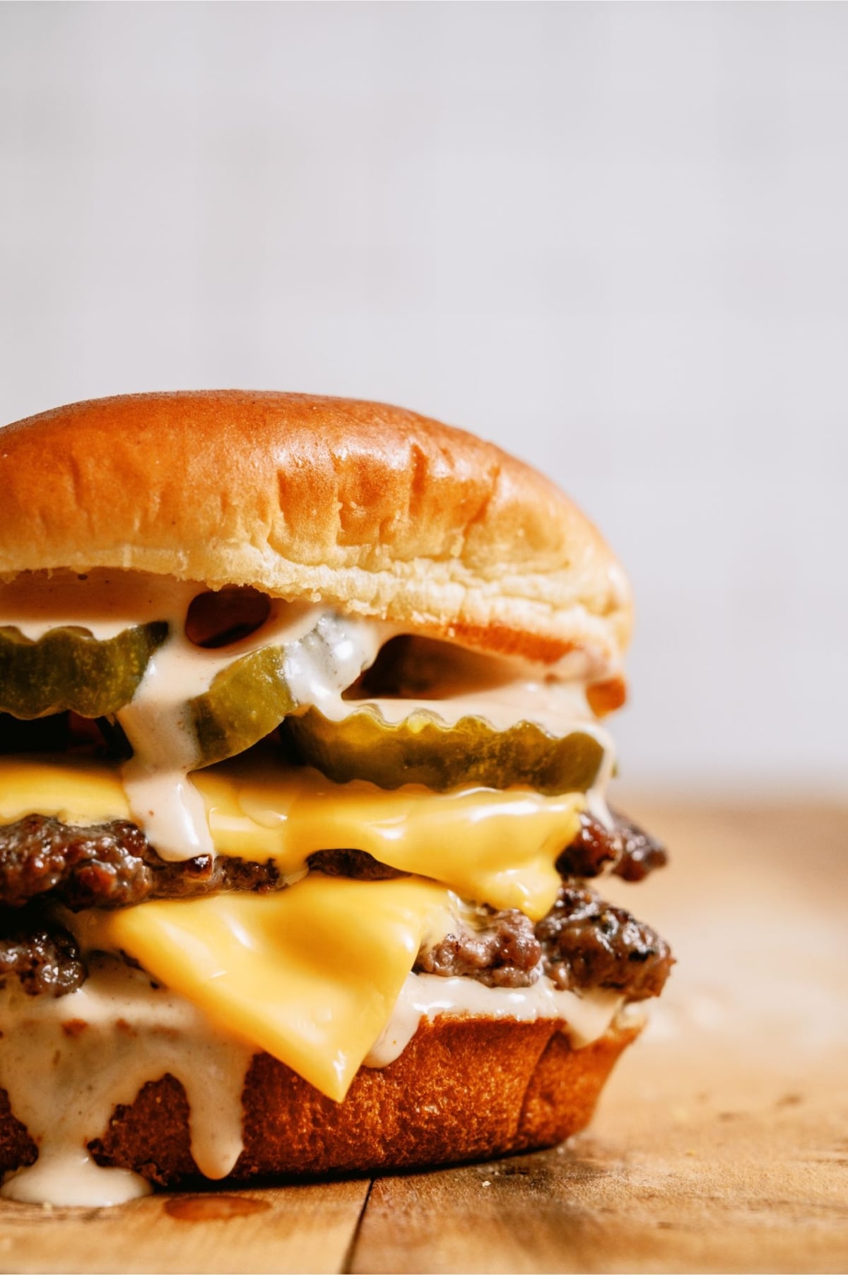 A Smash Burger with Shack Sauce on a countertop.