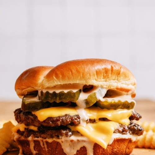 Smash Burger with Shack Sauce on a countertop.