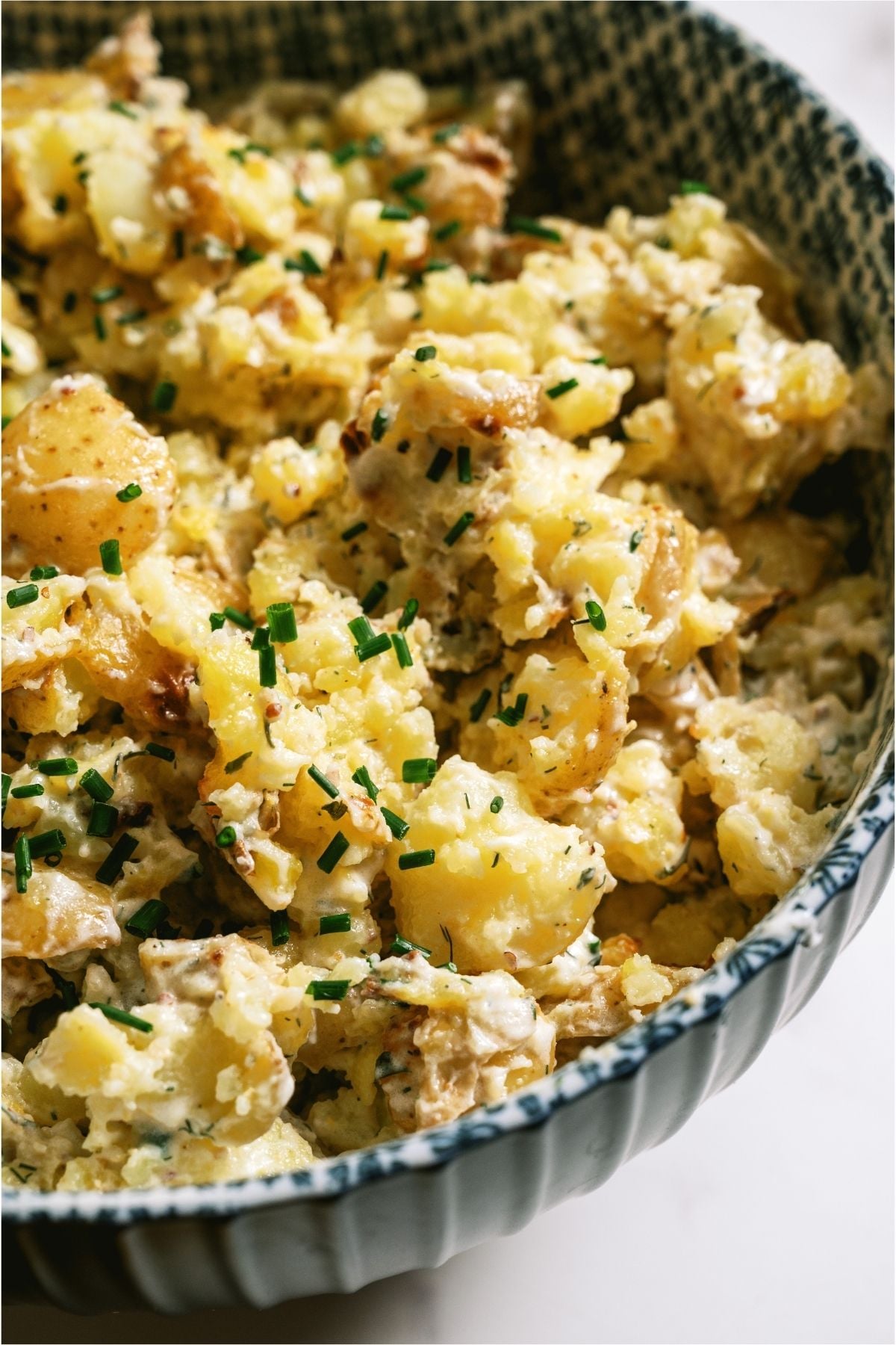 Crispy Smashed Potato Salad in a serving bowl.