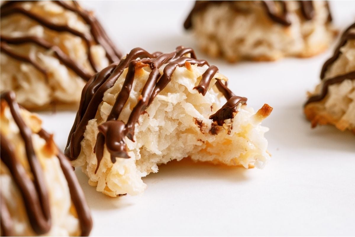 A Easy Coconut Macaroon with a bite missing out of it.