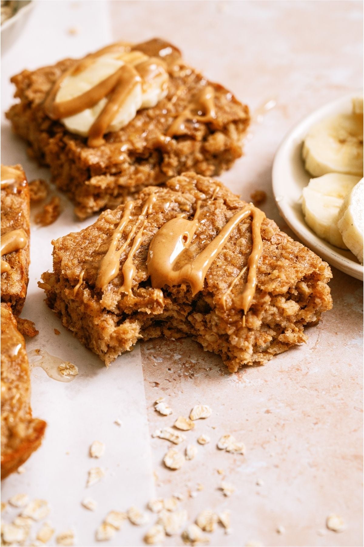 Close up of a Peanut Butter Banana Oatmeal Square missing a bite.