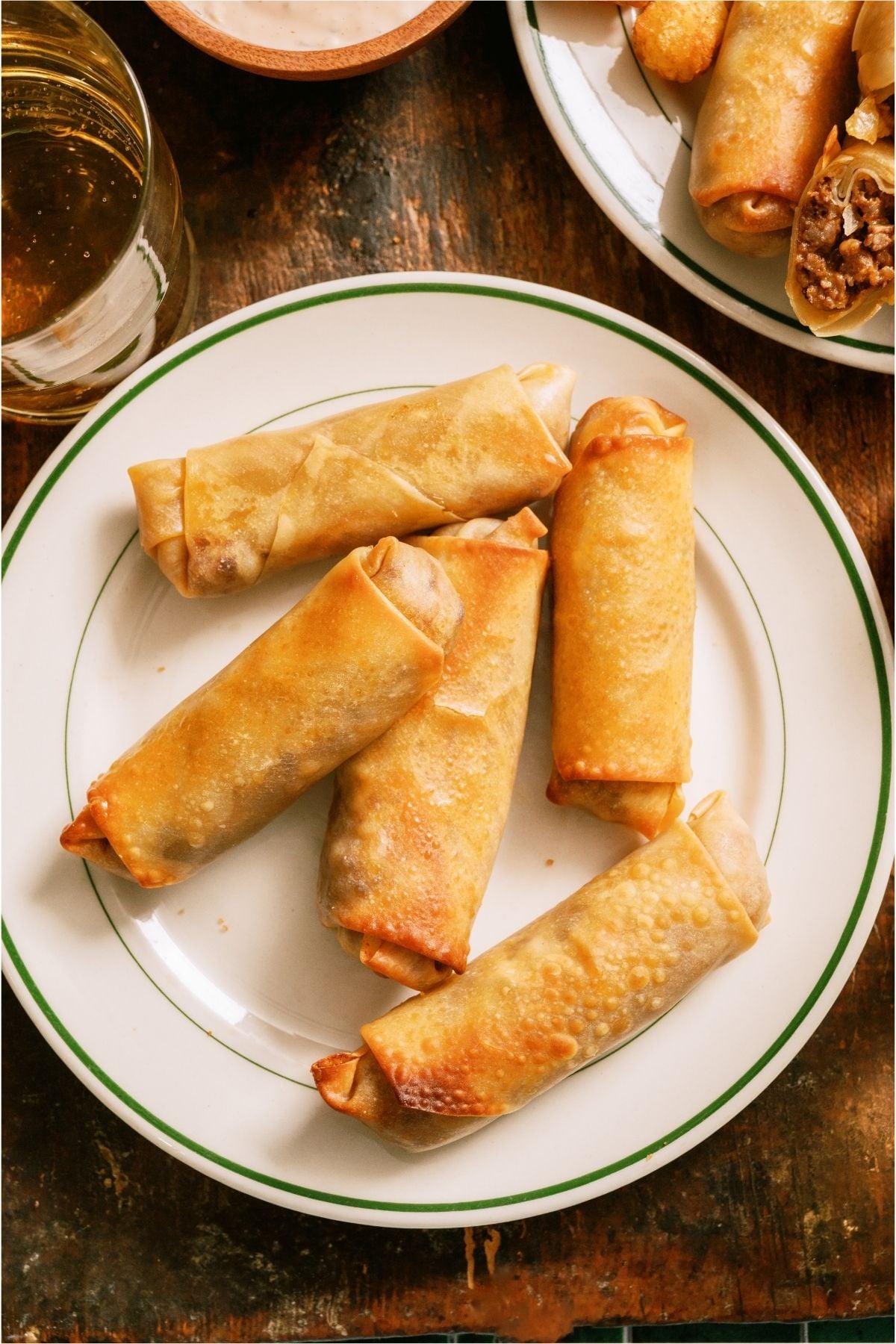 Top view of a plate of Cheeseburger Egg Rolls.