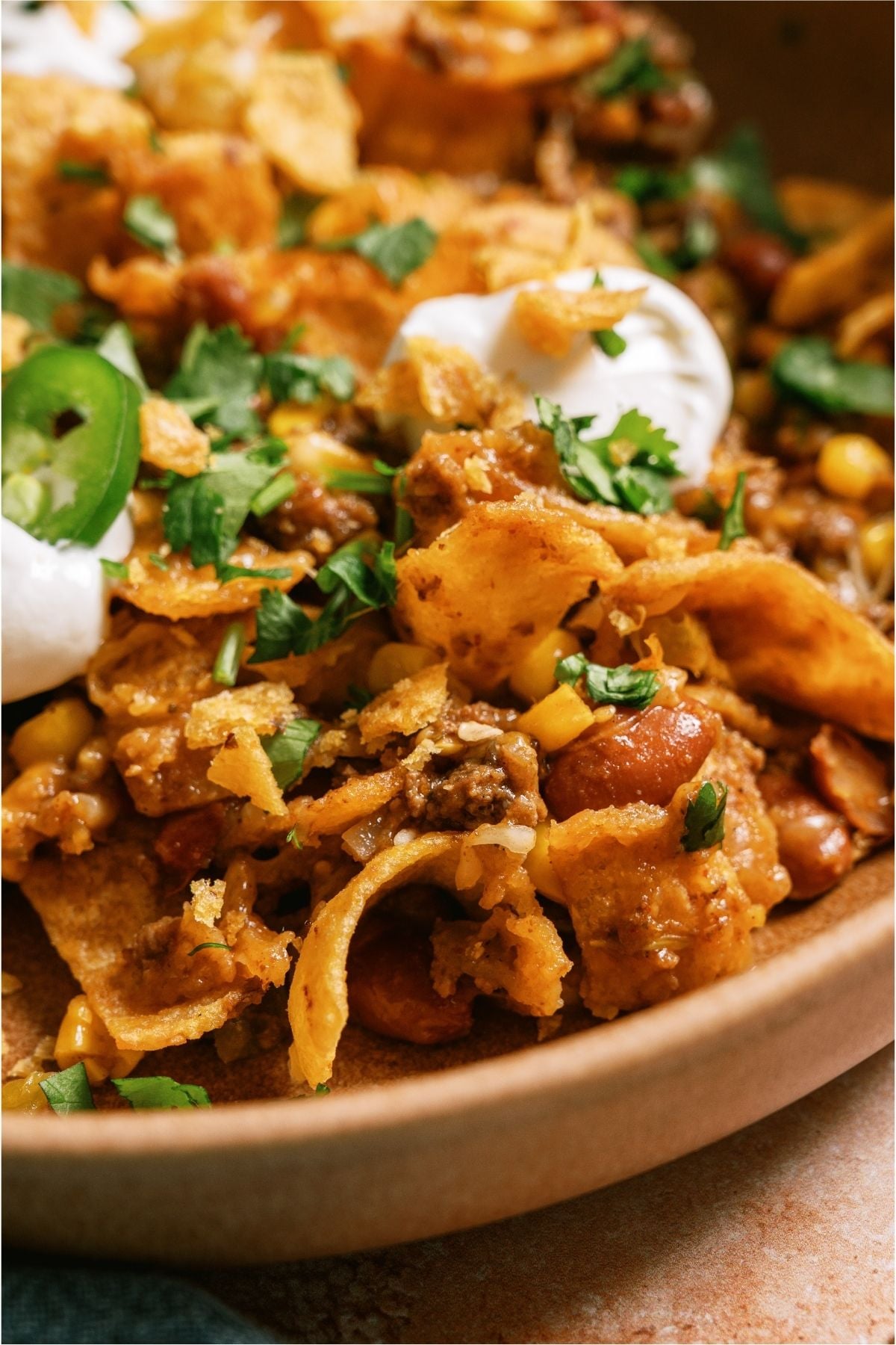 A serving of Frito Pie on a plate.