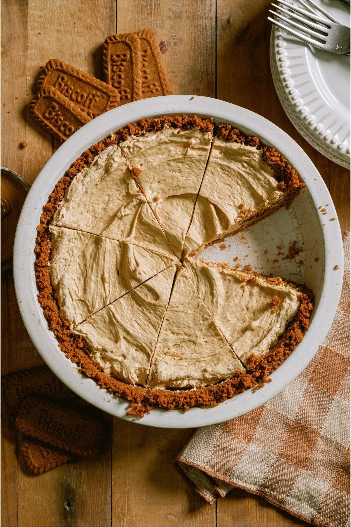 Top view of No Bake Biscoff Cheesecake cut into slices with one slice missing.