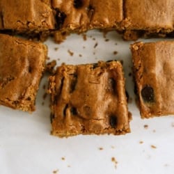 Close-up of chocolate chip cookie bars with one piece cut out.
